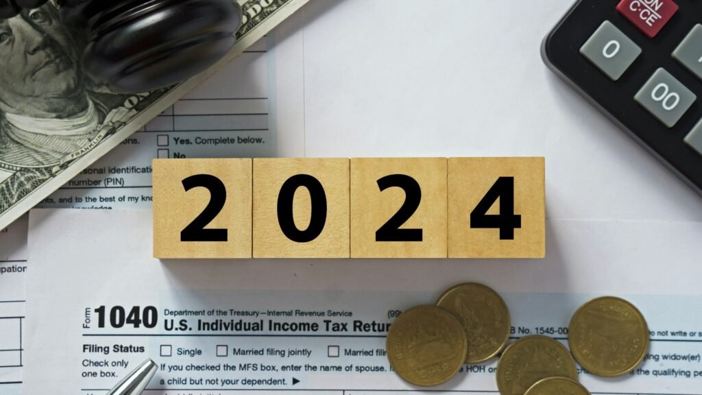 Tax 2024.2024 number on wooden block. Pay tax in 2024 years. The new year 2024 tax concept.